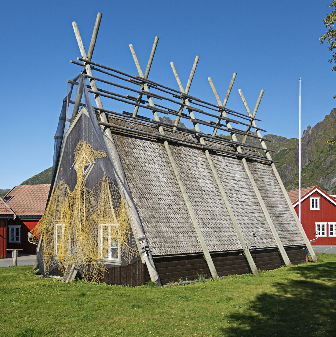 a building with a roof made of sticks
